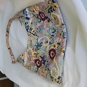 Purse with beading on front.